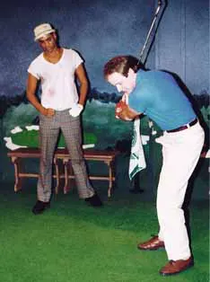 Two actors playing golf